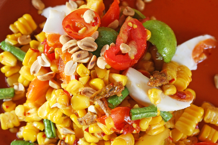 Corn spicy salad and crispy fishの写真素材