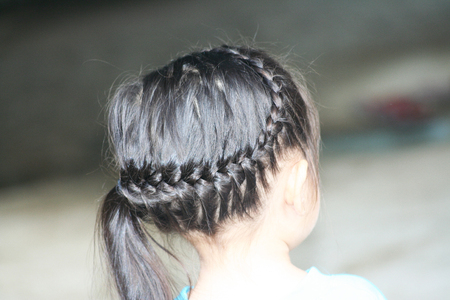 Braided hair on asian child  head