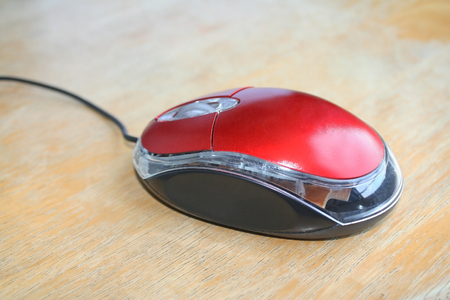 Red mouse on woodの写真素材