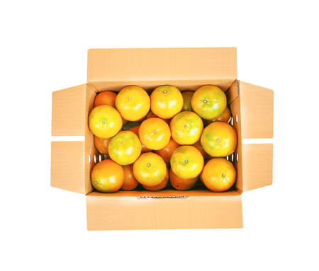 Top view fresh mandarin oranges in brown box isolated on white backgroundの写真素材