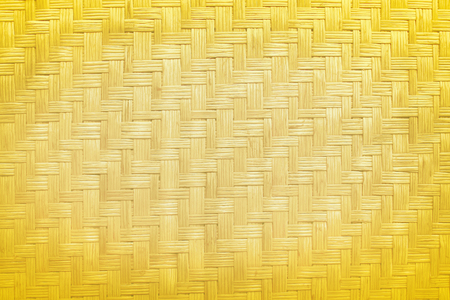 Gold natural wood texture background,Thai traditional handcraft weave,made from dried plants (reed or cyperus, imbricatus)の写真素材