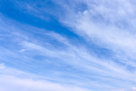 Clouds and light breeze on blue sky backgroundの写真素材