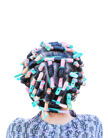 Back head of asian woman curling and colorful rollers with hair perm solution isolated on white backgroundの販売画像