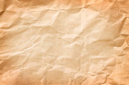Old blank wrinkle light brown paper texture abstract top view for background copy spaceの写真素材