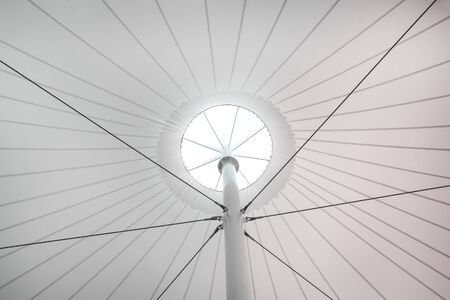 Structure modern canvas roof tents  bottom view on sky background