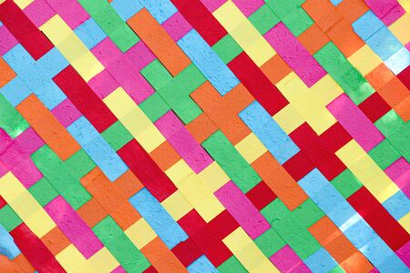 Close up paper woven shape texture with colorful patterns background