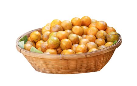 Fresh mandarin oranges in wood woven basket isolated on white background