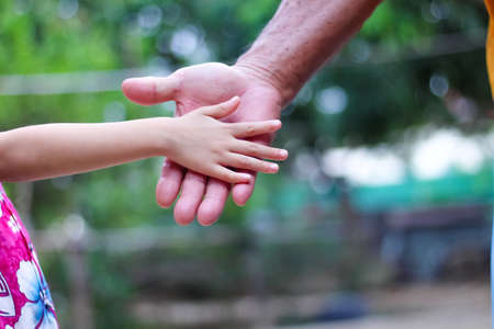 Grandchild hands and grandfather , familly asian backgroundの写真素材
