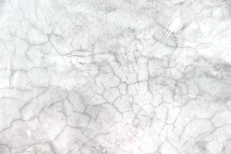 White grey cement wall texture with cracked patterns for old backgroundの写真素材