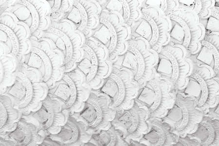 White serpent scale wall with seamless patterns on crafts backgroundの写真素材