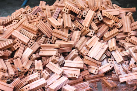 Bricks pile on the ground construction site background