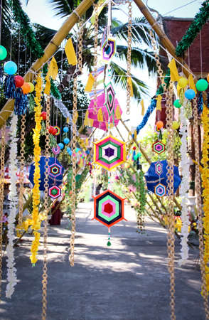 Colorful hanging mobile decorative on bamboo wood arch backgroundの写真素材