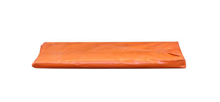 Orange polythene envelope  delivery shipping packaging closed isolated on white backgroundの写真素材