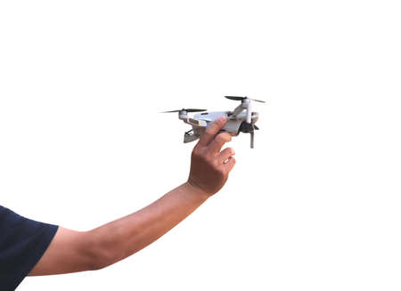 Man hand holding drone flying isolated on white background