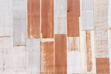 Old rusty zinc sheet texture wall vertical patterns , vintage style metal of fence rural fence home on backgroundの写真素材