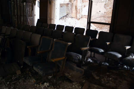chairs in an abandoned theaterの写真素材