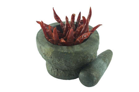 stone mortar and pestle with mixed dry food isolated on white backgroundの写真素材