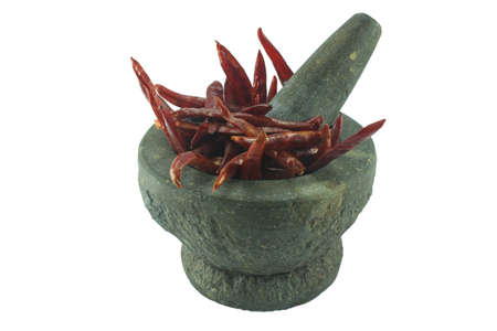 stone mortar and pestle with mixed dry food isolated on white backgroundの写真素材