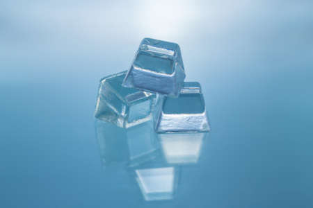 ice cubes on glass tableの写真素材