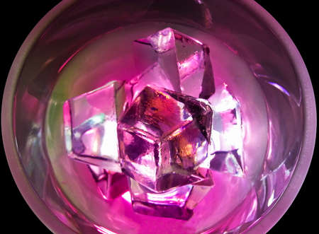 Glass of water and ice on black backgroundの写真素材