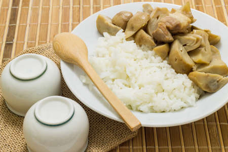 Stir fried mushrooms with pork on wooden background,Thai food.の写真素材
