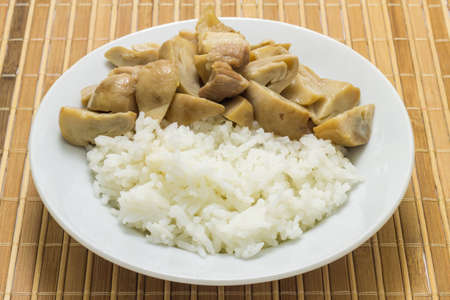 Stir fried mushrooms with pork on wooden background,Thai food.の写真素材