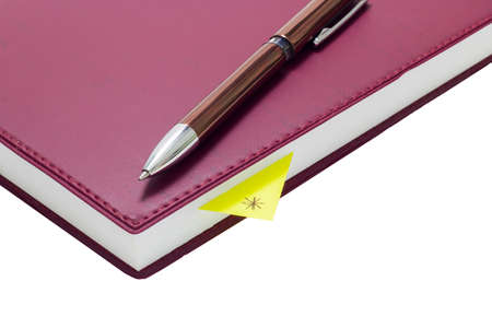 Pen on book isolated on white background.