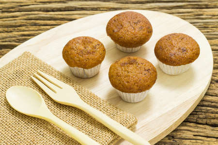 Banana cup cake on wooden background.の写真素材