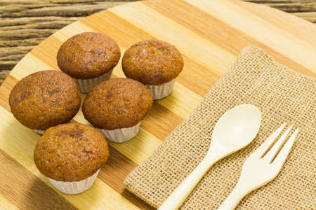 Banana cup cake on wooden background.の写真素材