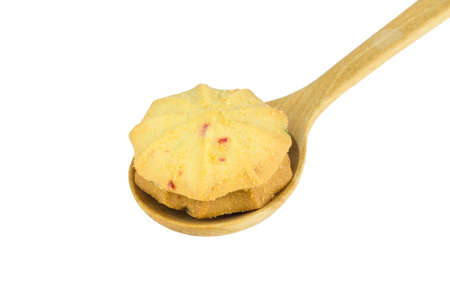 Cookies on wooden spoon on white background.の写真素材
