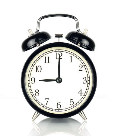 Alarm Clock isolated on white, in black and white, showing nine o'clock.の写真素材