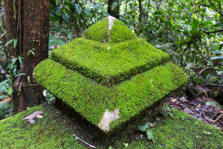 Old pagoda cover by moss at Phlio waterfall national park , Chanthaburi , Thailand.の写真素材