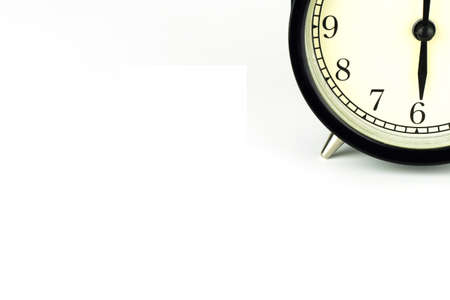 Alarm Clock on white, showing six o'clock.の写真素材