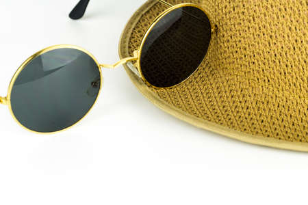 Hat and sunglasses isolated on a white background.の写真素材