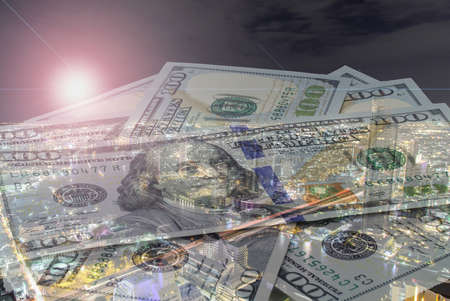 Double exposure of money with cityscape blurred building background. の写真素材