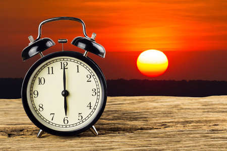 Clock with a view of the sunset background.