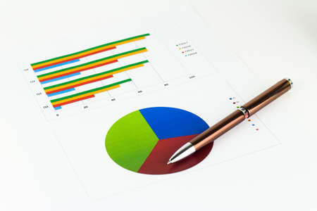 Analyzing graphics, calculations, savings, finances and economy concept.の写真素材