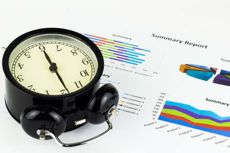 Analyzing graphics, calculations, savings with alarm clock.の写真素材