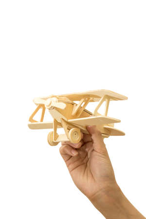 Toy airplane in hand isolated on white background with clipping path.の写真素材