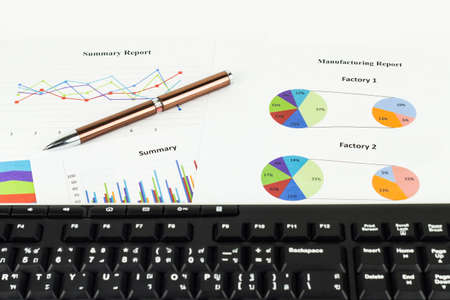 Keyboard and pen calculations, savings, finances and economy concept.の写真素材