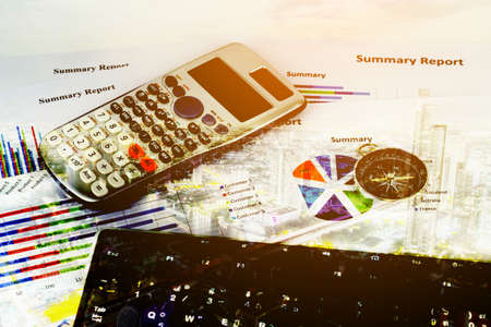 Double exposure of keyboard and alarm clock with city background.の写真素材