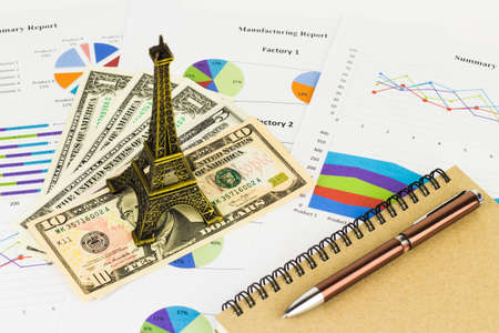 Business savings, finances and analysis economy concept with Eiffel tower replica.の写真素材