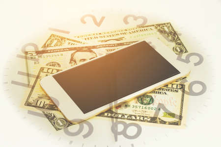 Double exposure of Money, Phone and clock for finance and banking concept.の写真素材