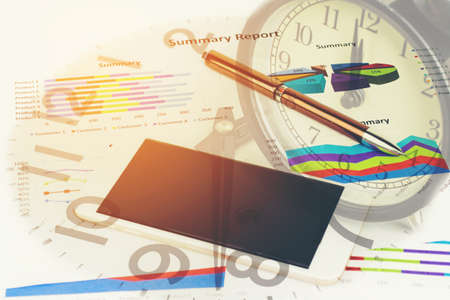 Double exposure of Business graph and clock for finance and banking concept.