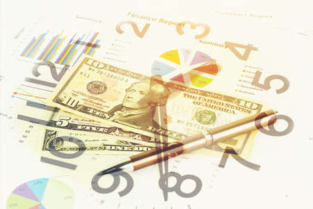 Double exposure of Business graph, money and clock for finance and banking concept.の写真素材