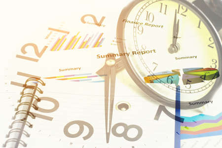 Double exposure of Business graph and clock for finance and banking concept.の写真素材