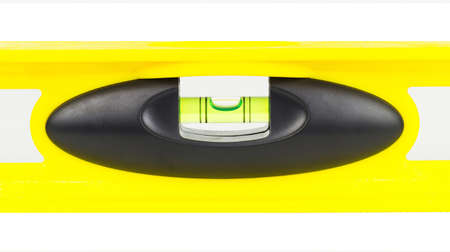 Yellow building level, balance ruler, isolated on a white background.