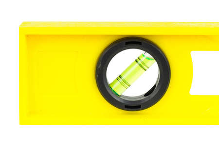 Yellow building level, balance ruler, isolated on a white background.の写真素材