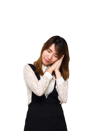 Beautiful young Asian woman with sleeping gesture isolated on white background.の写真素材