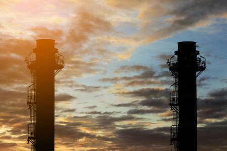 Silhouette Natural Gas Combined Cycle Power plant electricity generating station of industry in sunset sky.の写真素材